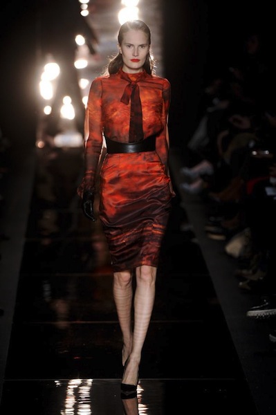Lace dresses in black red and vibrant prints swept the runway Monique 